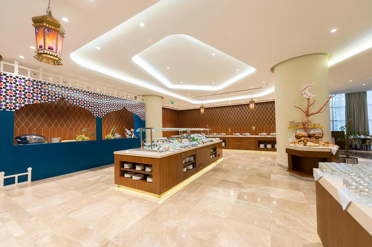 Holiday Suites Al Azizia Meca Exterior foto The hotel's restaurant