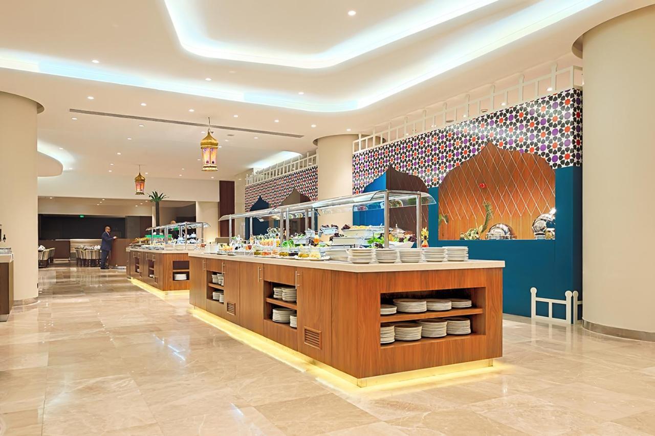 Holiday Suites Al Azizia Meca Exterior foto The hotel's restaurant